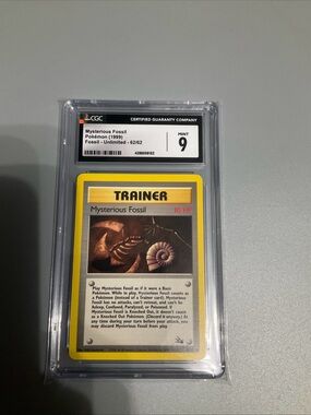 CGC Mint 9 Mysterious Fossil Pokémon Trainer Card (Yellow Border)